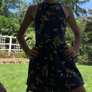 Blue backless romper.